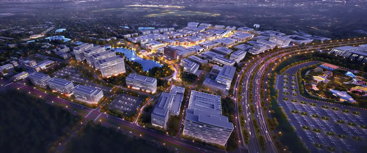 Aerial evening view of the Fields West mixed-use district near Wentwood Fields West apartments